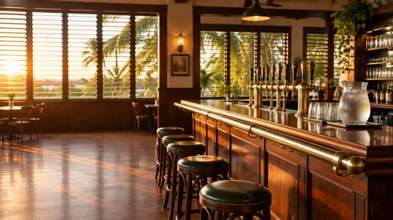A Queensland pub bar at golden hour with brass beer taps and a jug of iced water — RSA course Queensland